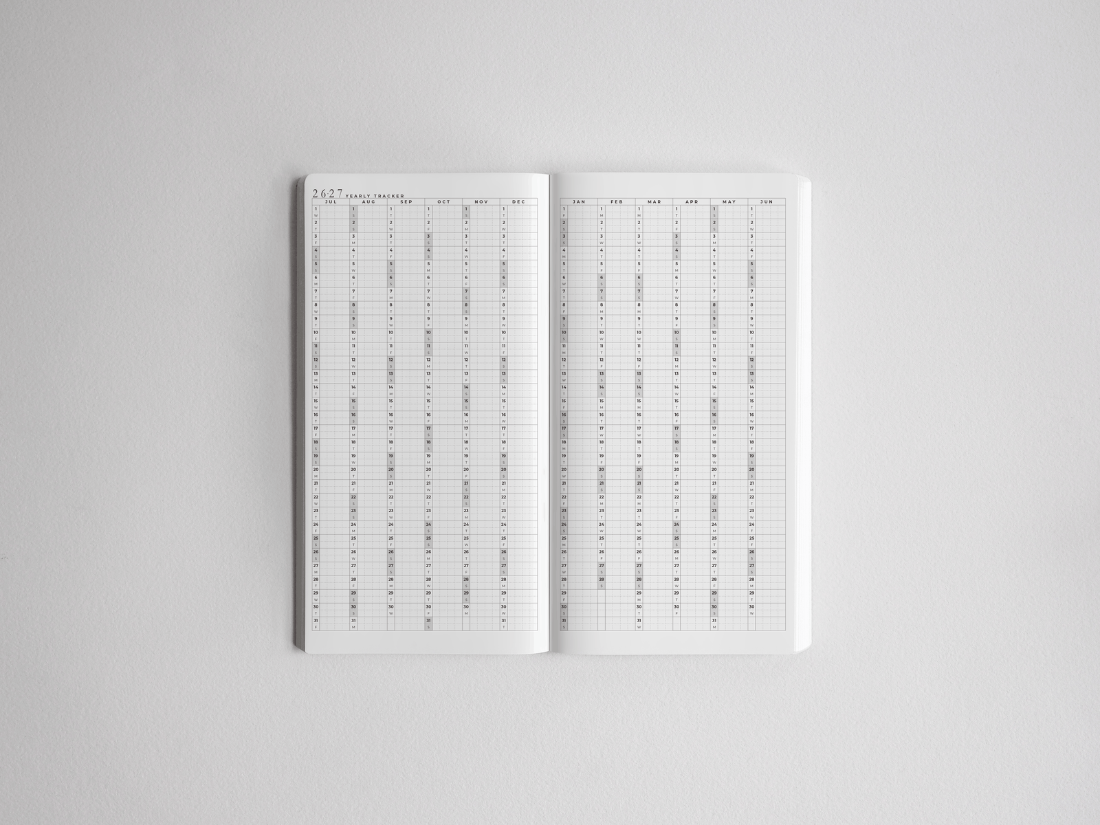 Open daily planner showing detailed, gridded pages for academic scheduling across the full 2026-2027 school year.