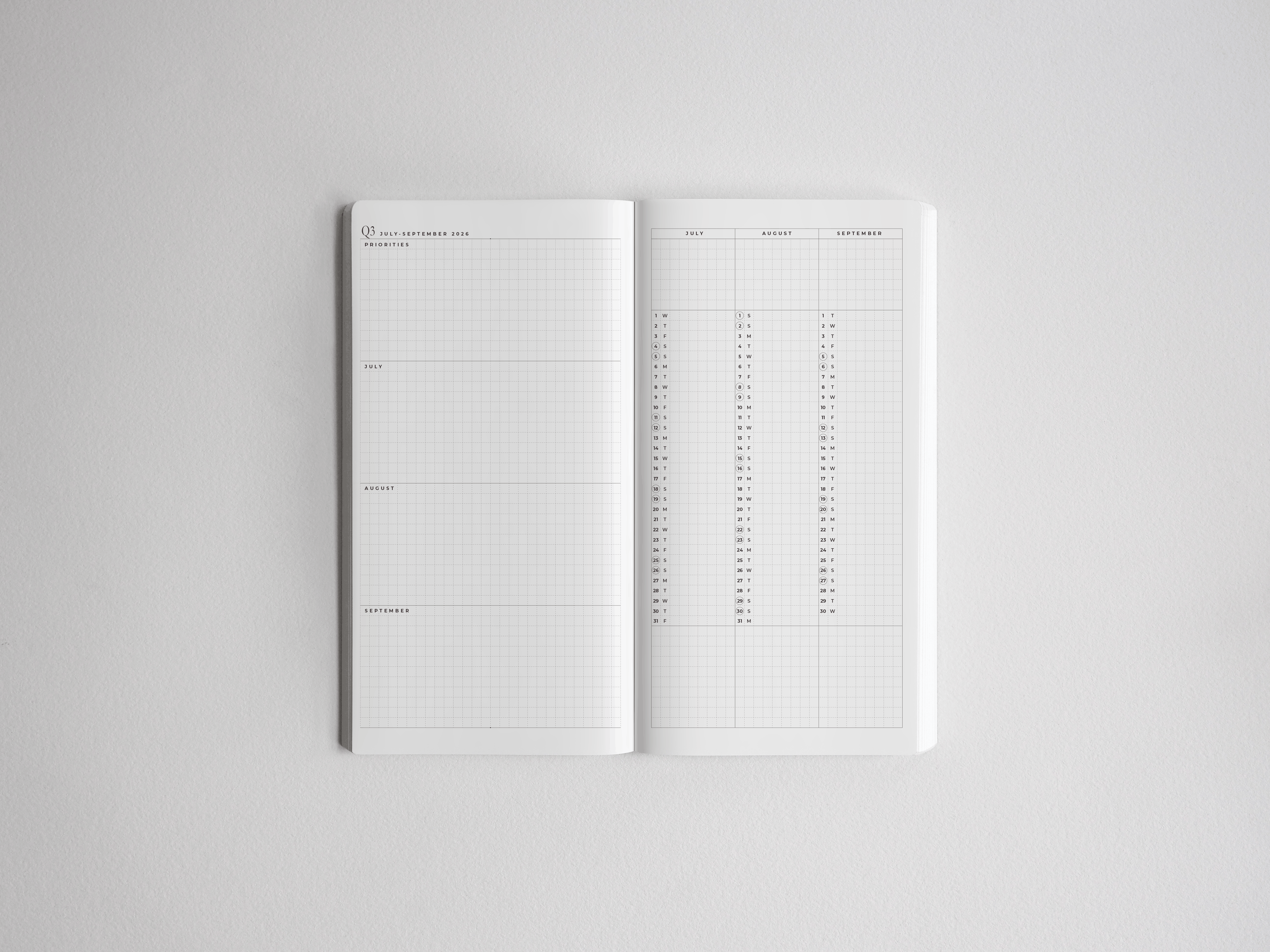 Minimalist white academic planner showing an open spread with structured weekly sections, perfect for comprehensive year-long academic goal setting.