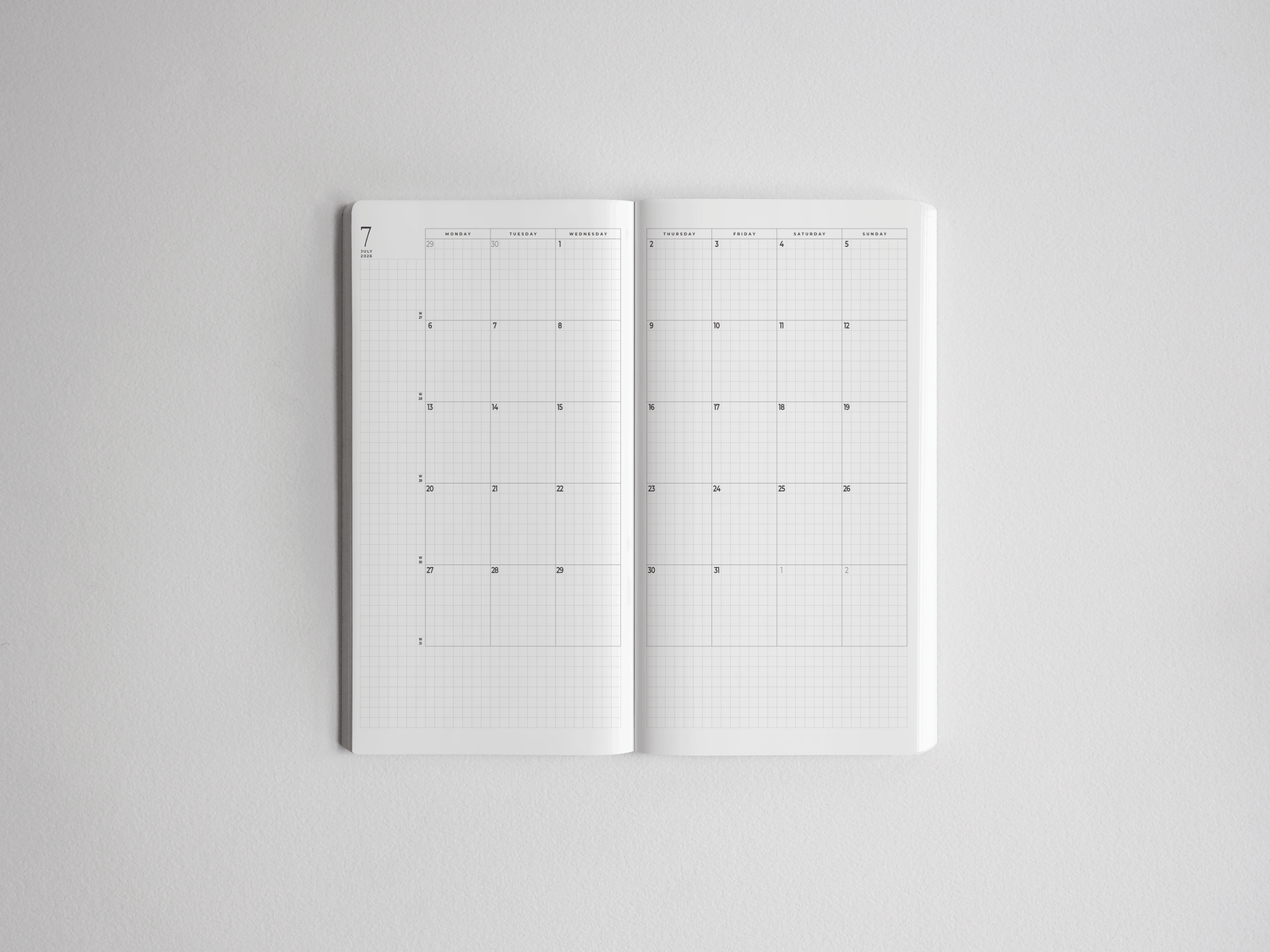Open academic planner featuring crisp, white, horizontally oriented gridded pages designed for comprehensive annual scheduling and tracking for the 2026-2027 school year.