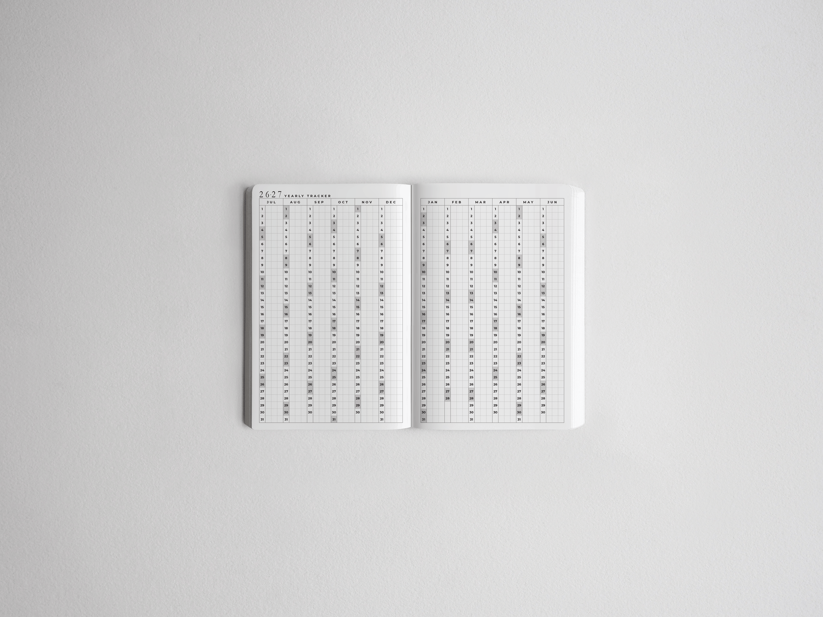 Clean, white academic daily planner featuring comprehensive yearly spreads and structured monthly grids for 2026–2027 scheduling.