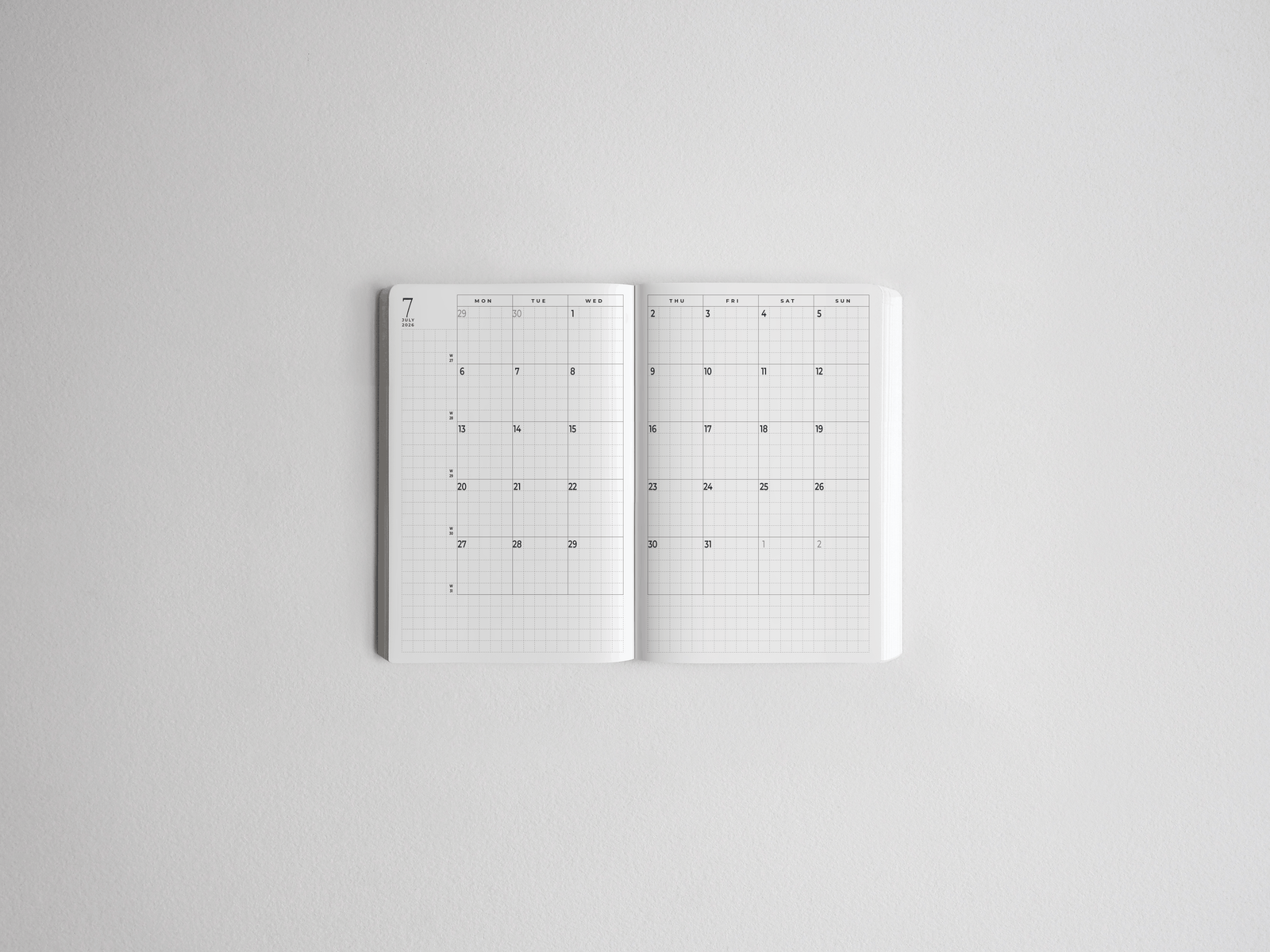 Minimalist white academic daily planner featuring an organized, spacious grid layout for tracking dates and scheduling throughout the full year.