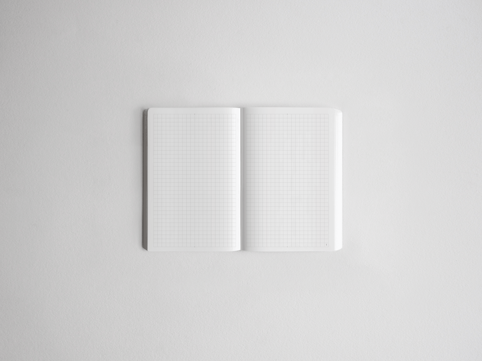 Open daily planner showing two pages of uniform white graph paper, ready for academic scheduling, note-taking, or year planning.