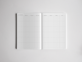 Open academic planner featuring a structured, segmented grid layout for goal tracking, daily planning, and comprehensive year-at-a-glance scheduling.