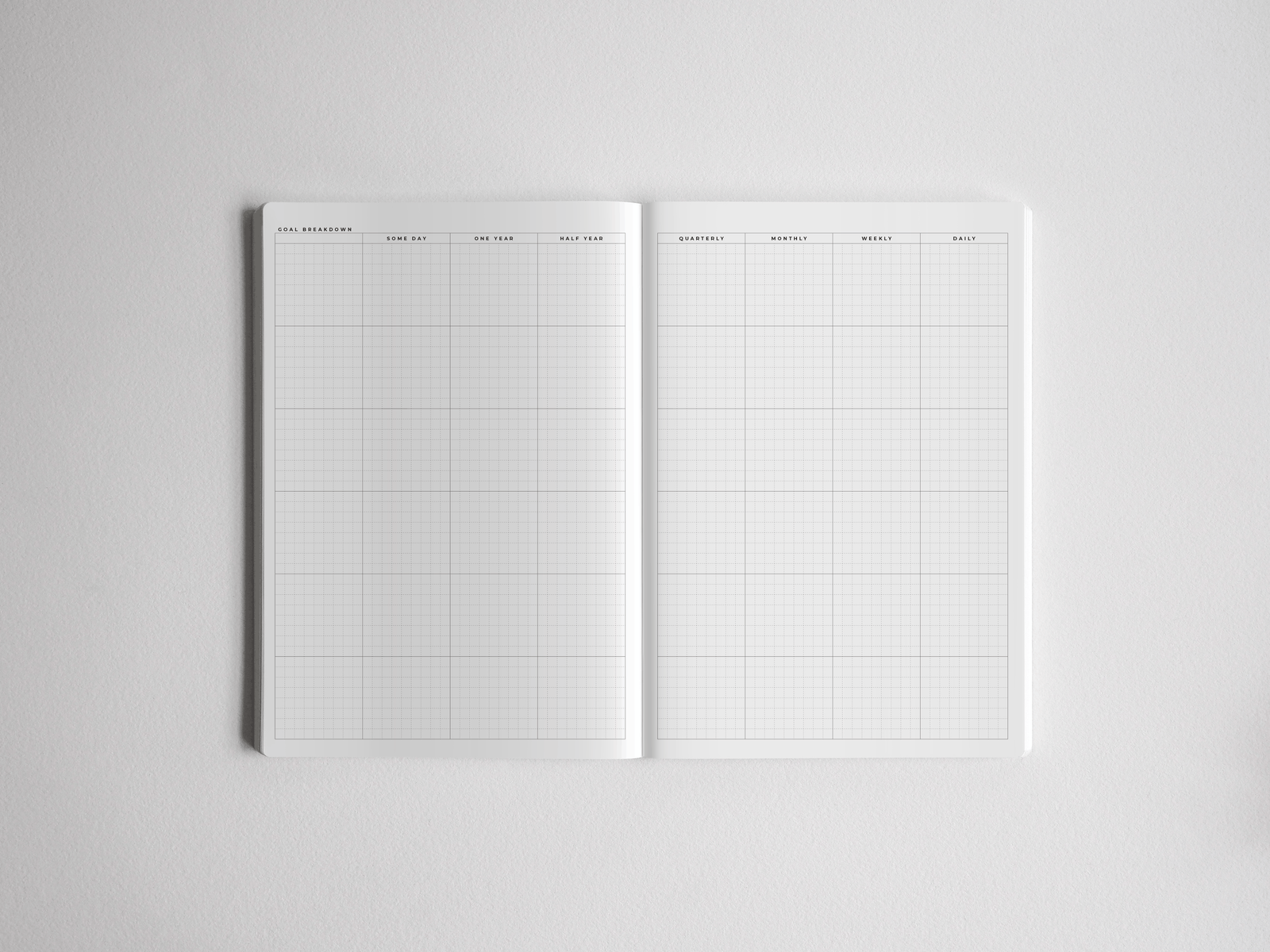 A horizontally opened A5 academic planner displaying a clean, gridded layout optimized for multi-year goal tracking and comprehensive planning across various time frames.