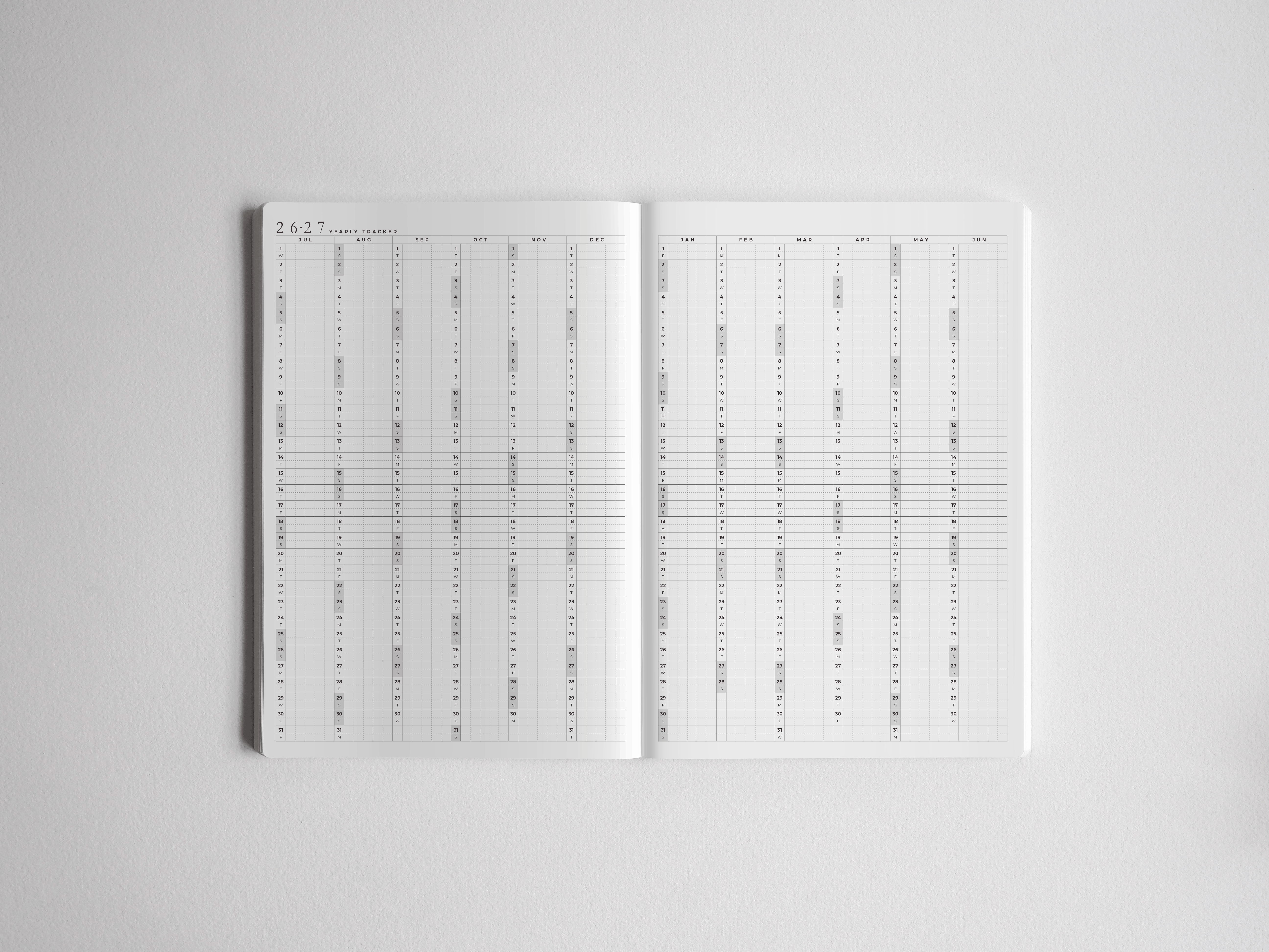 Open A5 academic planner featuring a clean, white layout with full-year monthly grids for 2026-2027, designed for comprehensive student or professional scheduling.