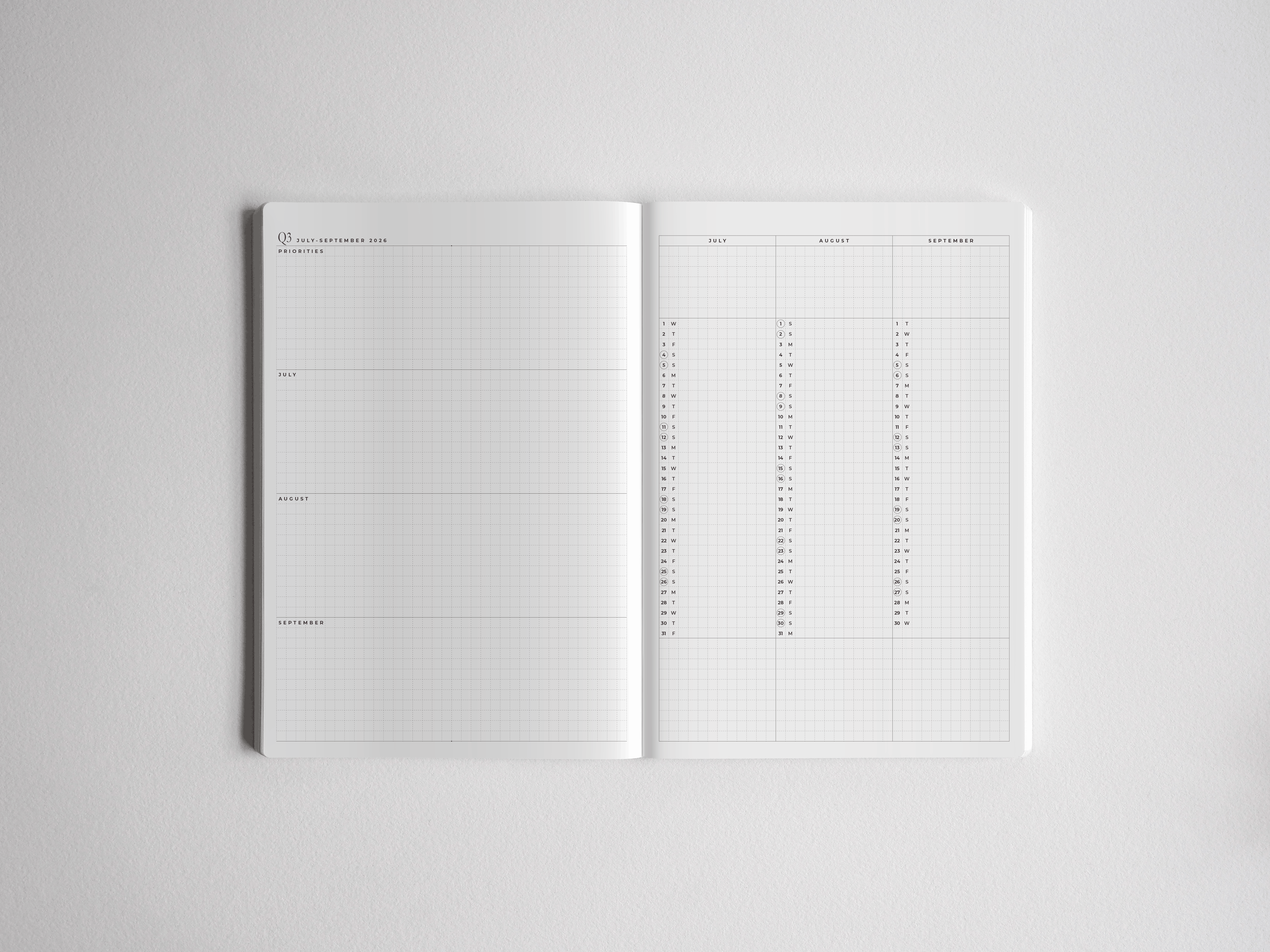 Open A5 academic planner showcasing clean, white, multi-column grids segmented for monthly organization and full-year planning for students.