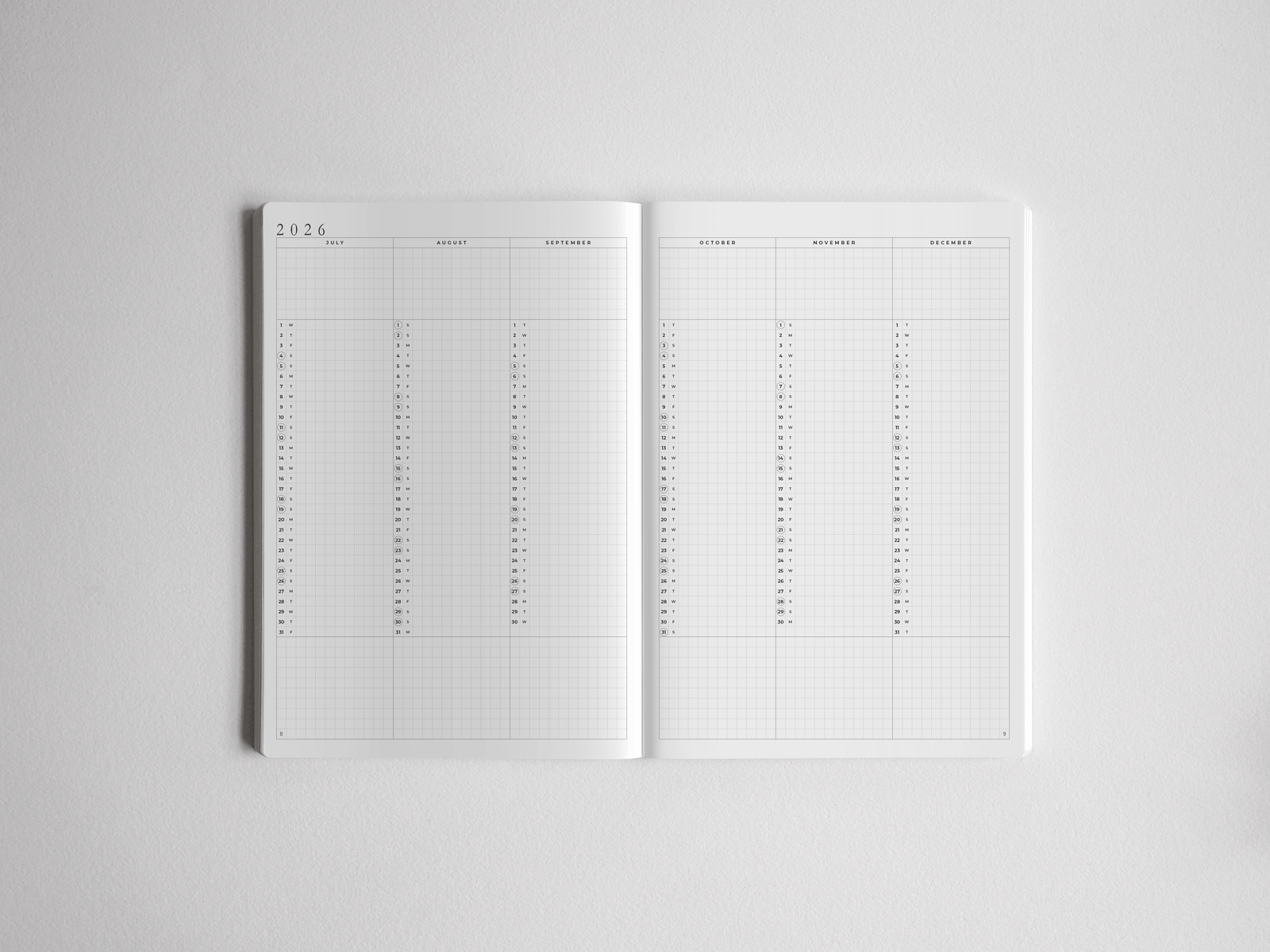 Detailed white A5 daily academic planner open to a yearly view, featuring structured monthly grids for planning the 2026–2027 school year.