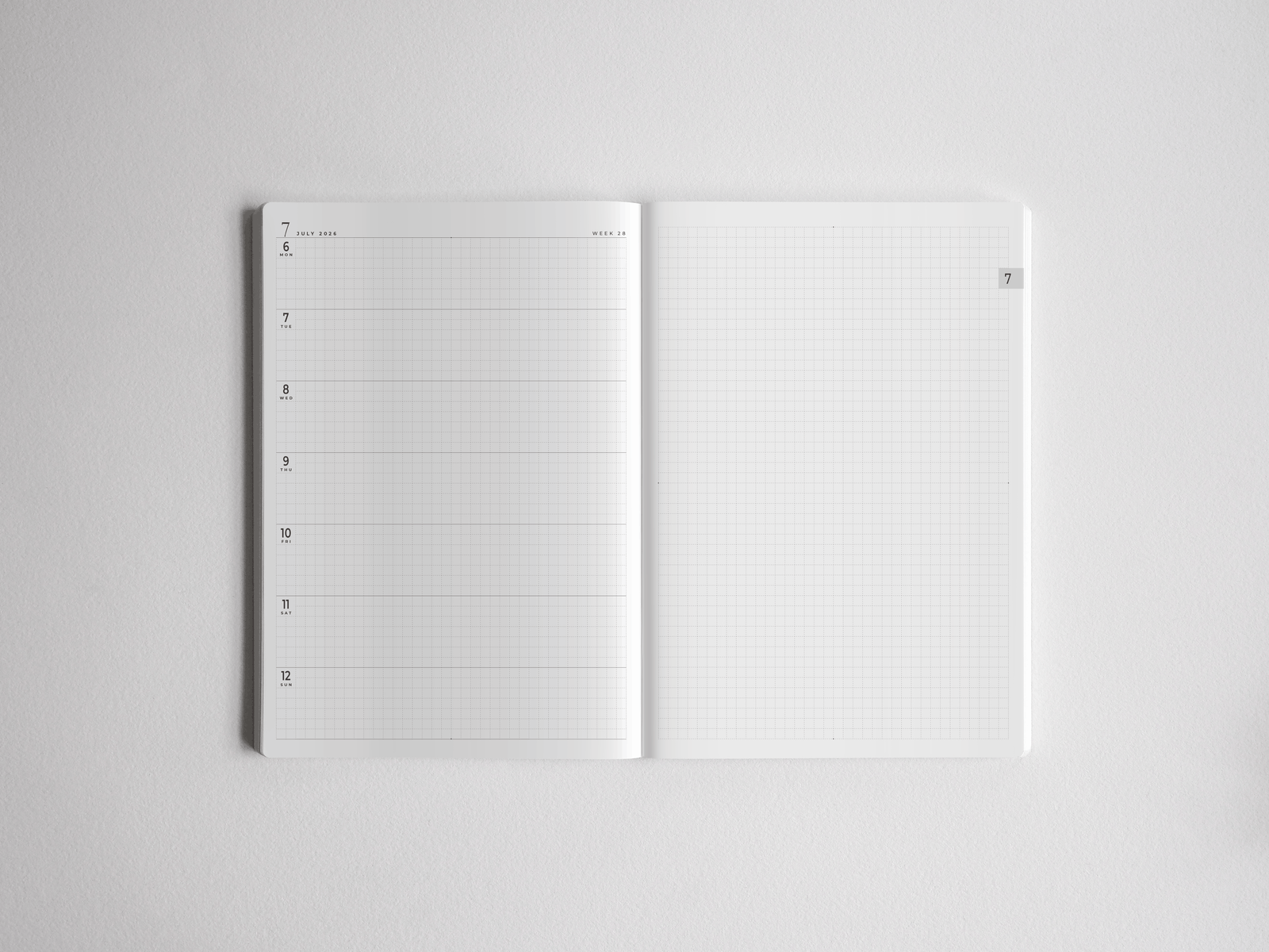 Open white A5 academic planner featuring a dated, structured weekly section on the left and functional squared graph paper on the right for comprehensive note-taking.