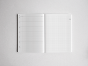 Open white A5 academic planner featuring a dated, structured weekly section on the left and functional squared graph paper on the right for comprehensive note-taking.
