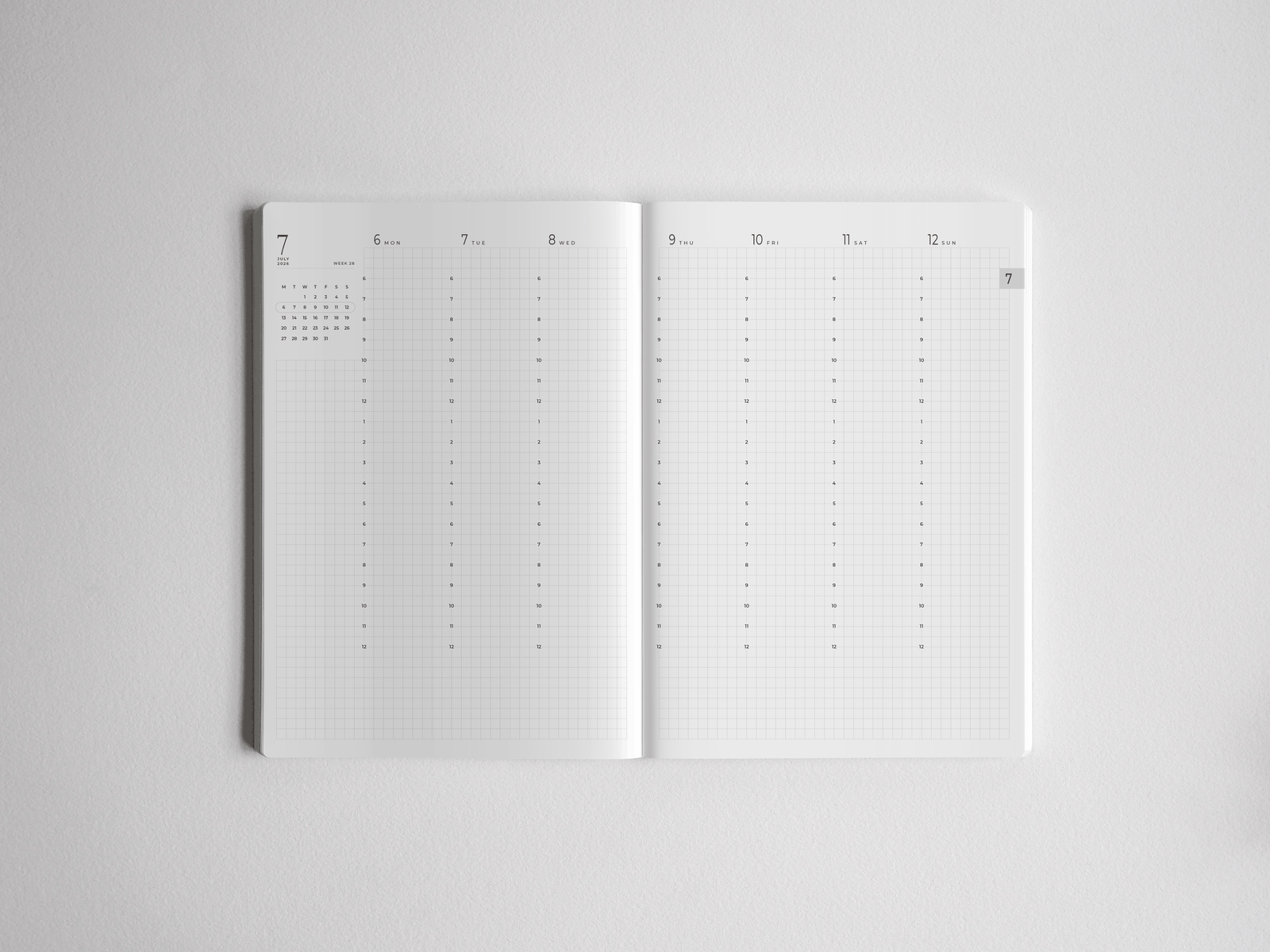 Minimalist open A5 academic planner featuring a full year calendar spread with dated, lined writing sections for organizing 2026-2027 studies.