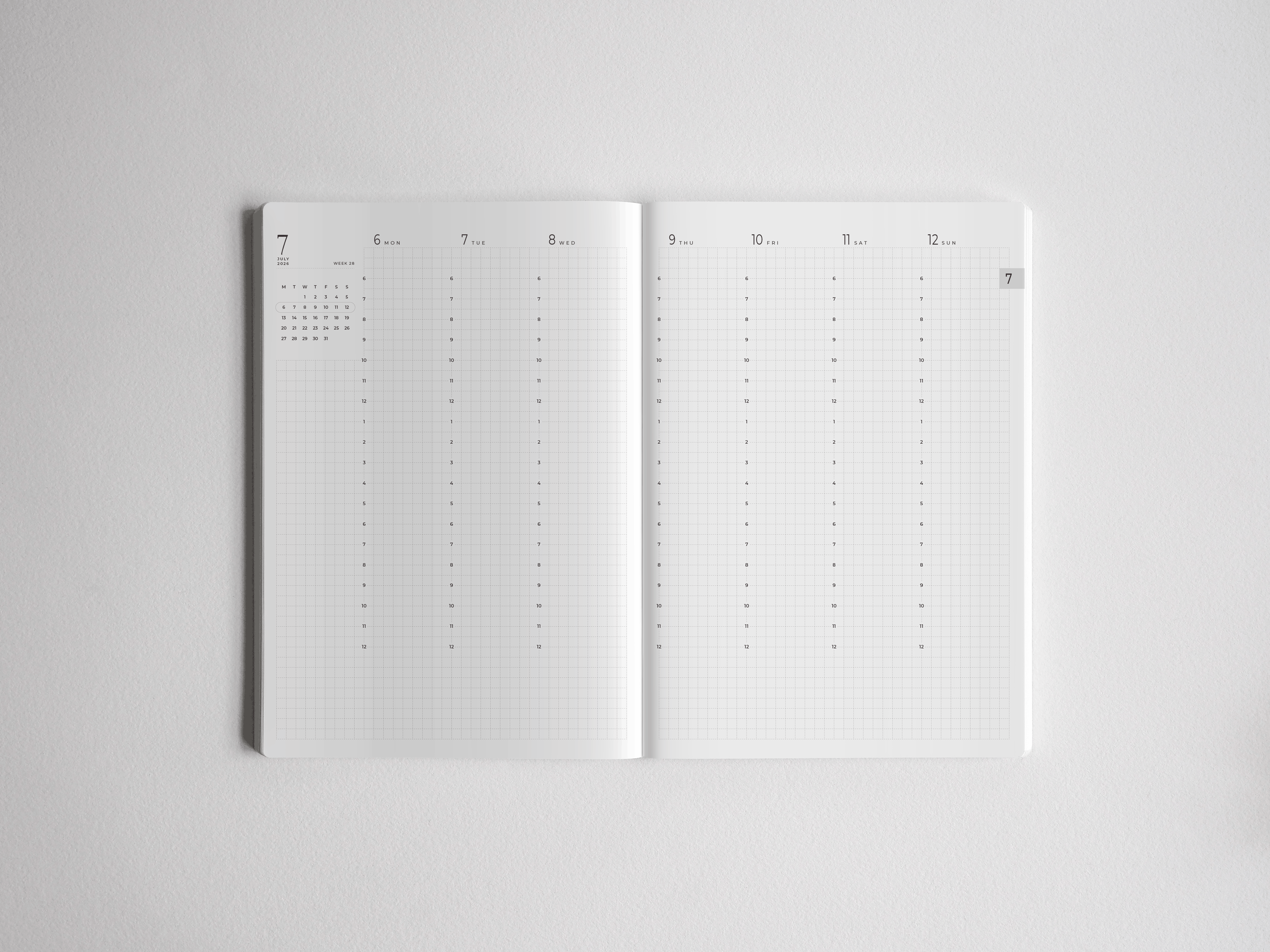 Minimalist open A5 academic planner featuring a full year calendar spread with dated, lined writing sections for organizing 2026-2027 studies.