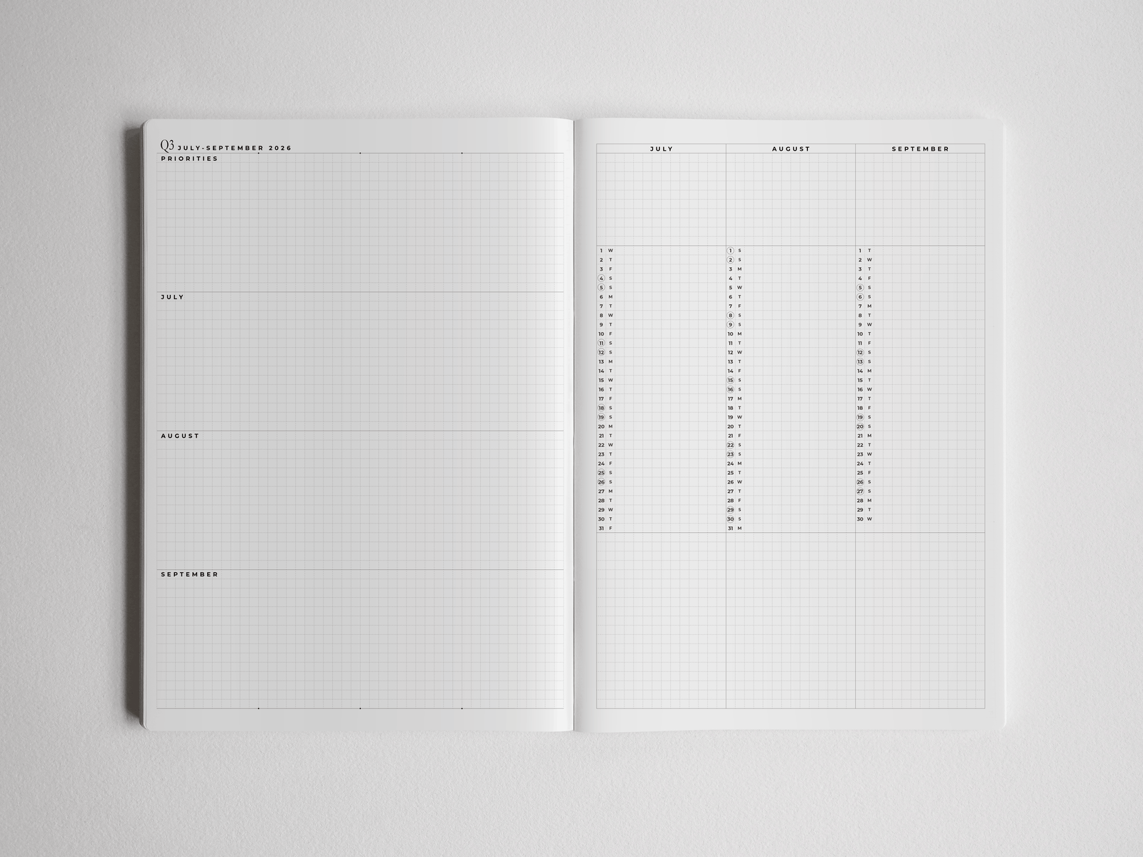 Open B5 academic planner displaying a clean, organized monthly spread with labeled grids for year-long scheduling and academic planning.