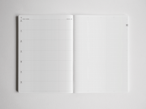 Open B5 academic planner detailing dated schedules and complemented by blank graph paper, providing versatile, comprehensive space for full-year study planning.