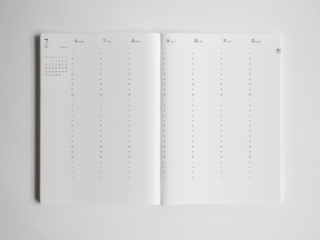 Comprehensive academic planner spread featuring crisp white pages and structured black grids designed for year-long scheduling and detailed planning for 2026-2027.