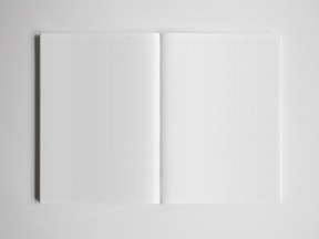 Open academic planner displaying two connected pages filled with faint light gray grid paper, perfect for detailed year planning and note-taking.