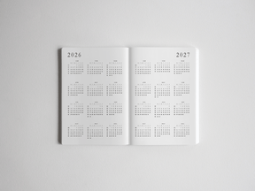 Structured B6 academic planner displaying minimalist, full-year calendar grids for 2026 and 2027, perfect for tracking academic schedules.