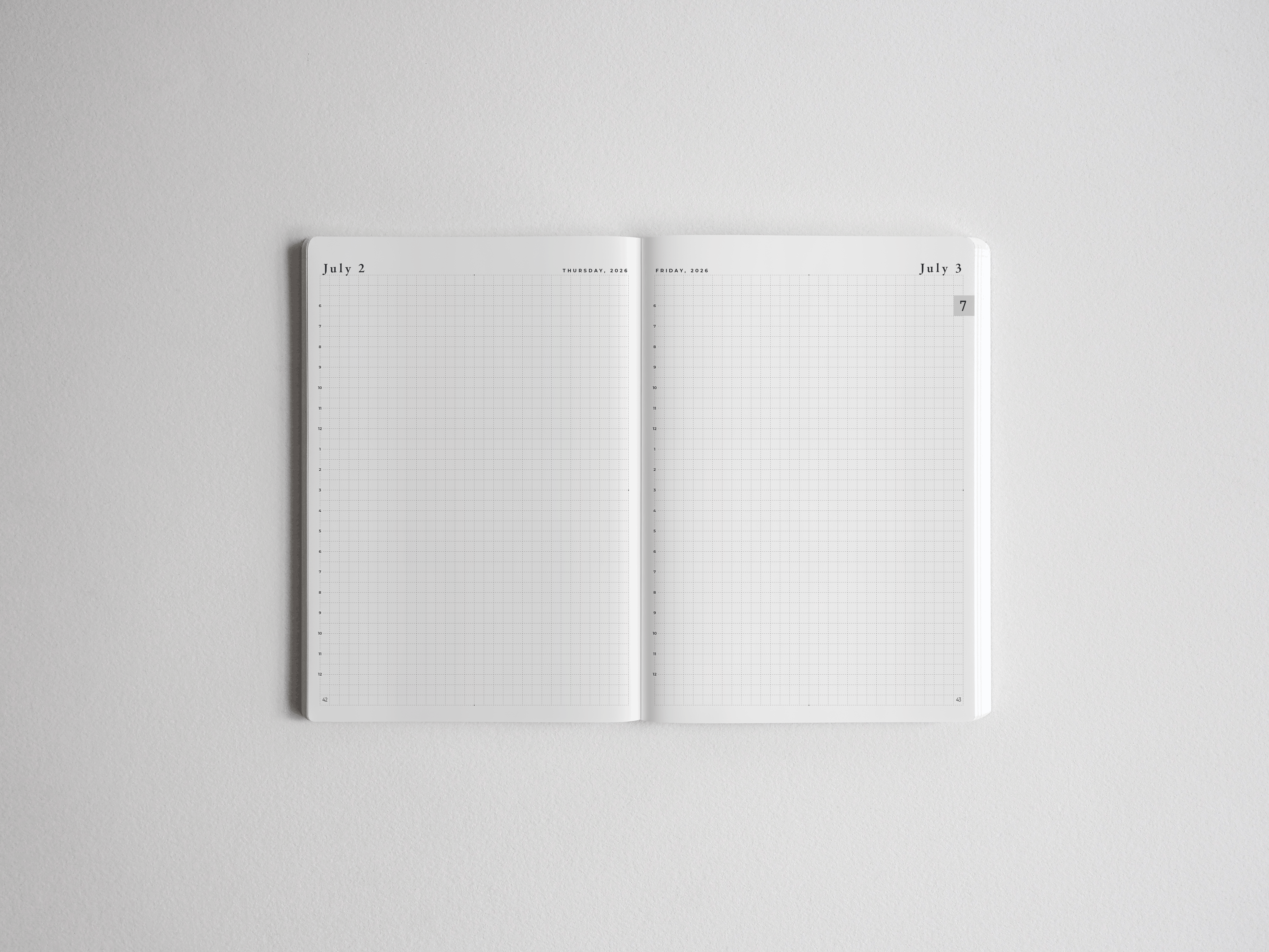 Open academic daily planner spread featuring crisp white pages with fine-lined graph paper grids and dated headers for structured scheduling.