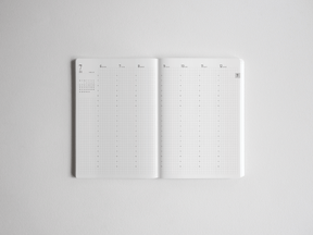 Minimalist B6 academic planner spread featuring vertical weekly layouts and numbered columns for comprehensive, full-year scheduling.