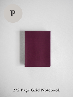 Solid, deep maroon notebook with a smooth, uniform cover, designed for writing and planning.