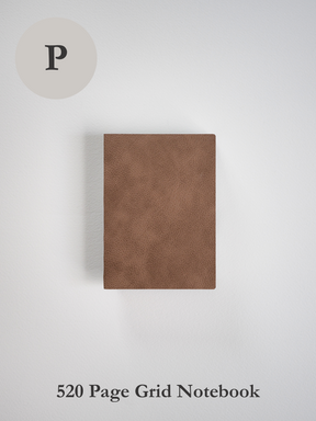 Rich, solid cocoa brown notebook with a uniform, matte cover featuring a subtly textured surface for journaling or writing.
