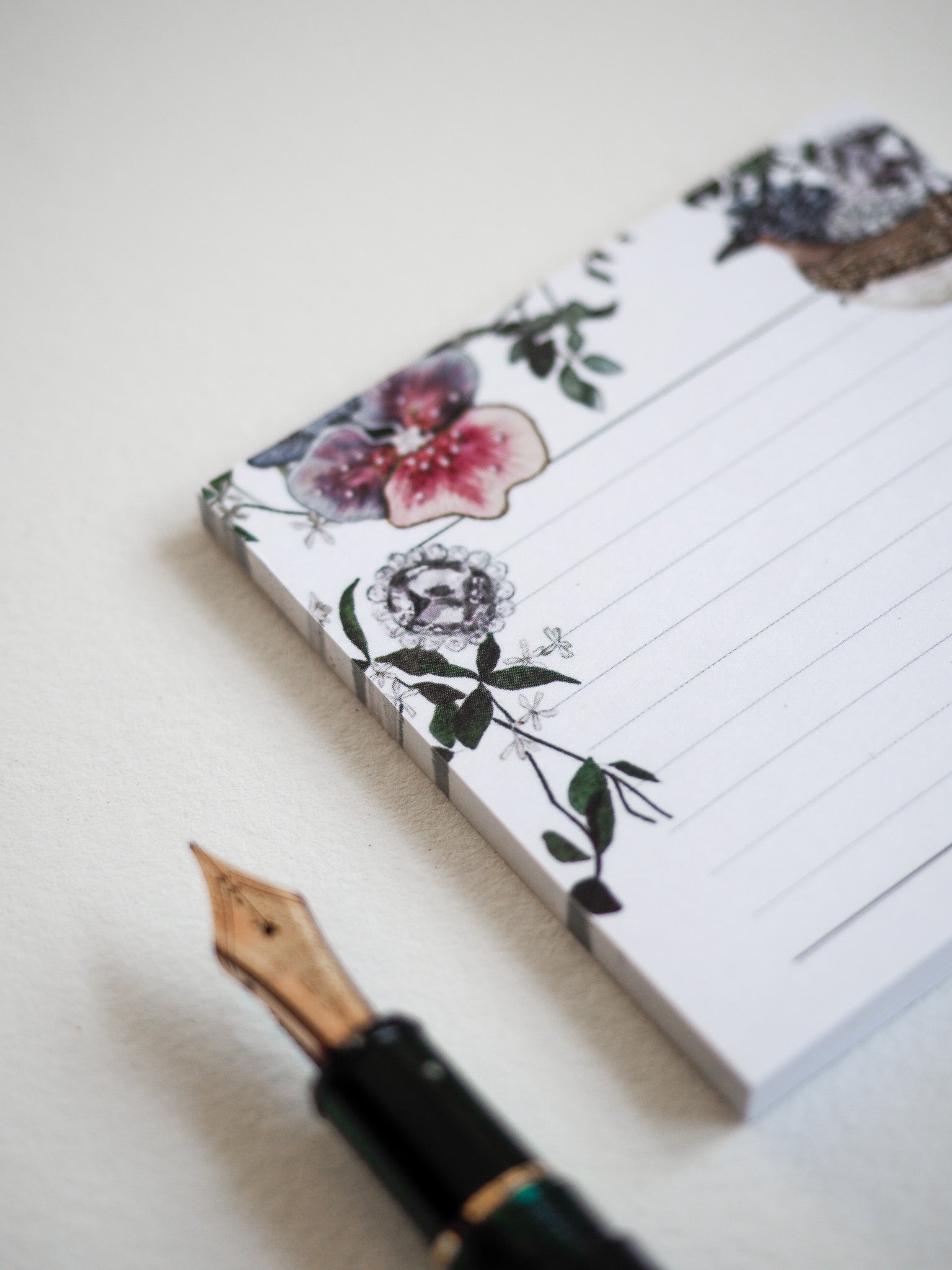 Sheet of floral sticky notes featuring a romantic, detailed pattern of pink blooms, delicate greenery, and sweet small birds for journaling.