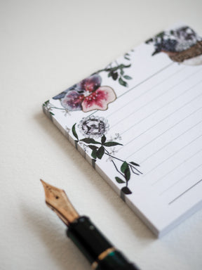 Sheet of floral sticky notes featuring a romantic, detailed pattern of pink blooms, delicate greenery, and sweet small birds for journaling.