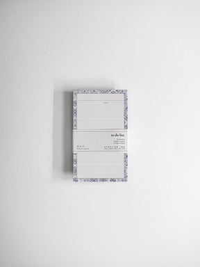 Elegant to-do list notepad featuring ruled lines and a decorative, detailed damask border design for planning and organization.