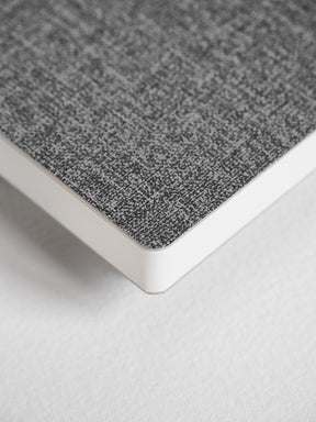 A compact, full-year planner featuring a minimalist, textured charcoal gray cover with clean white edges, ready for 2026 planning.