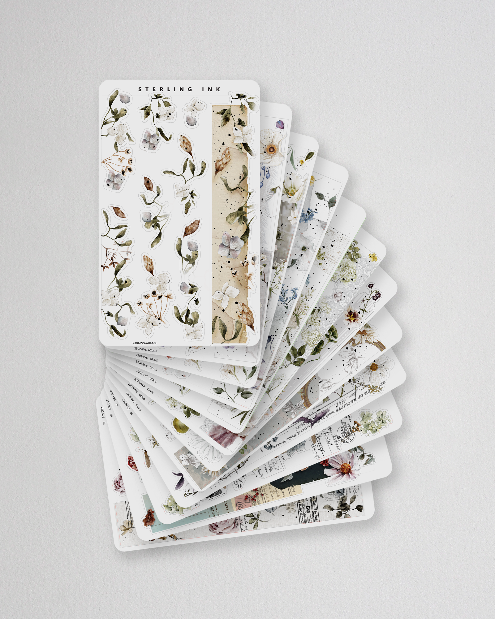 A seasonal set of botanical washi strip stickers featuring delicate, muted illustrations of pressed flowers, leaves, and natural greenery.