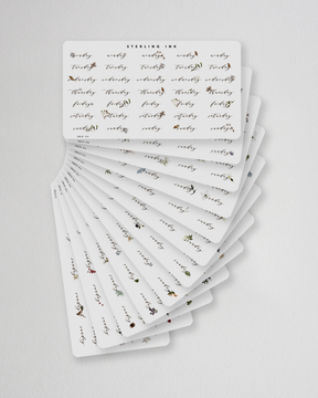 Elegant botanical sticker set designed for journaling, featuring muted florals and weekly date trackers for year-long planning.