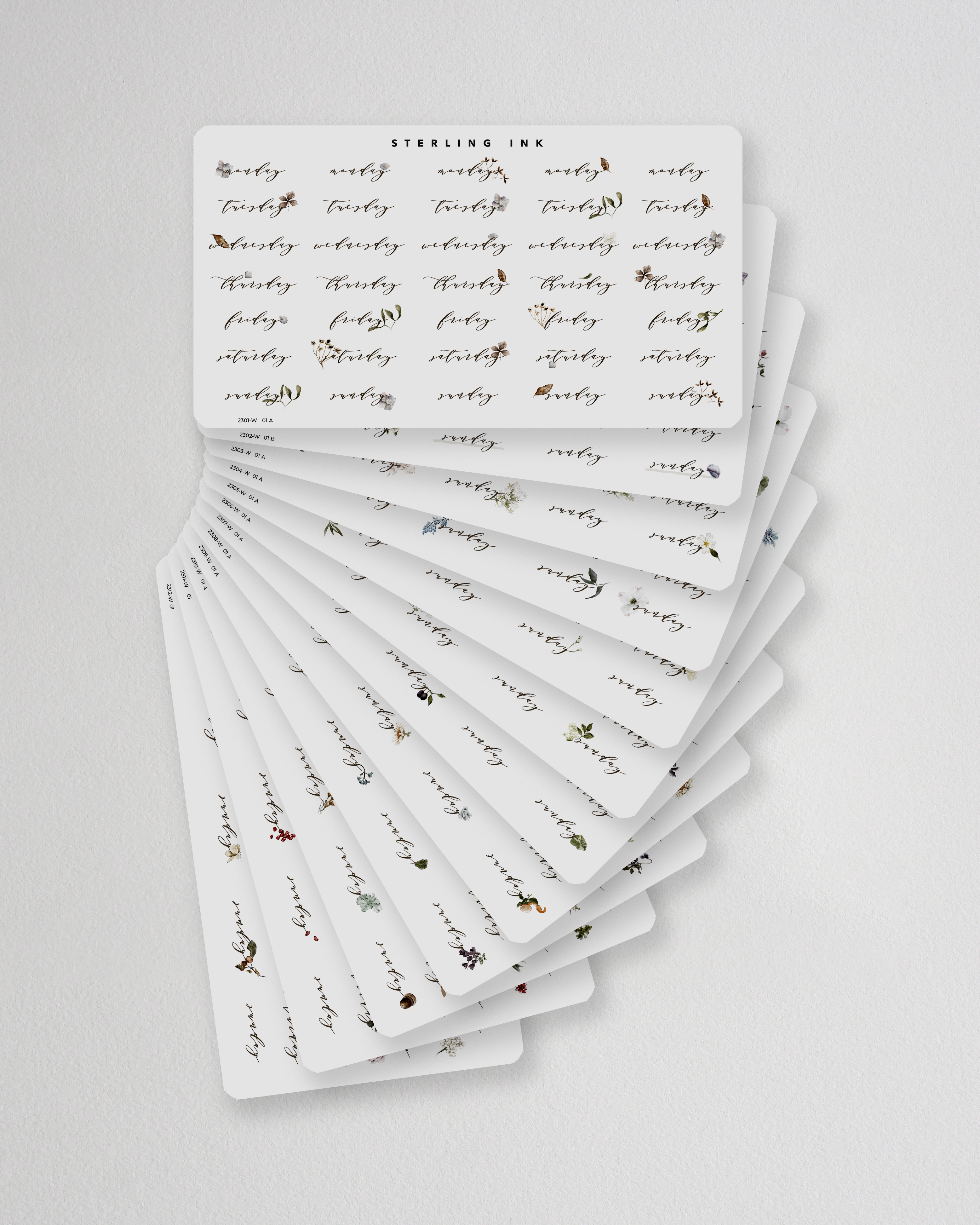 Elegant botanical sticker set designed for journaling, featuring muted florals and weekly date trackers for year-long planning.