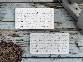 Three white decorative sticker sheets featuring vintage floral and botanical designs, ideal for planning and journaling through the months of the year.