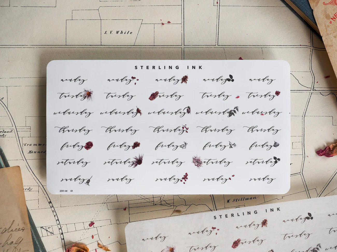 A sticker sheet displaying a repeating, patterned layout of hand-written, brown ink labels for all weekdays, ideal for journaling and planning.