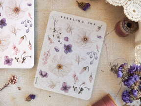 Delicate watercolor botanical elements featuring soft mauve and blush illustrations of various blooms, leaves, and trailing berries.