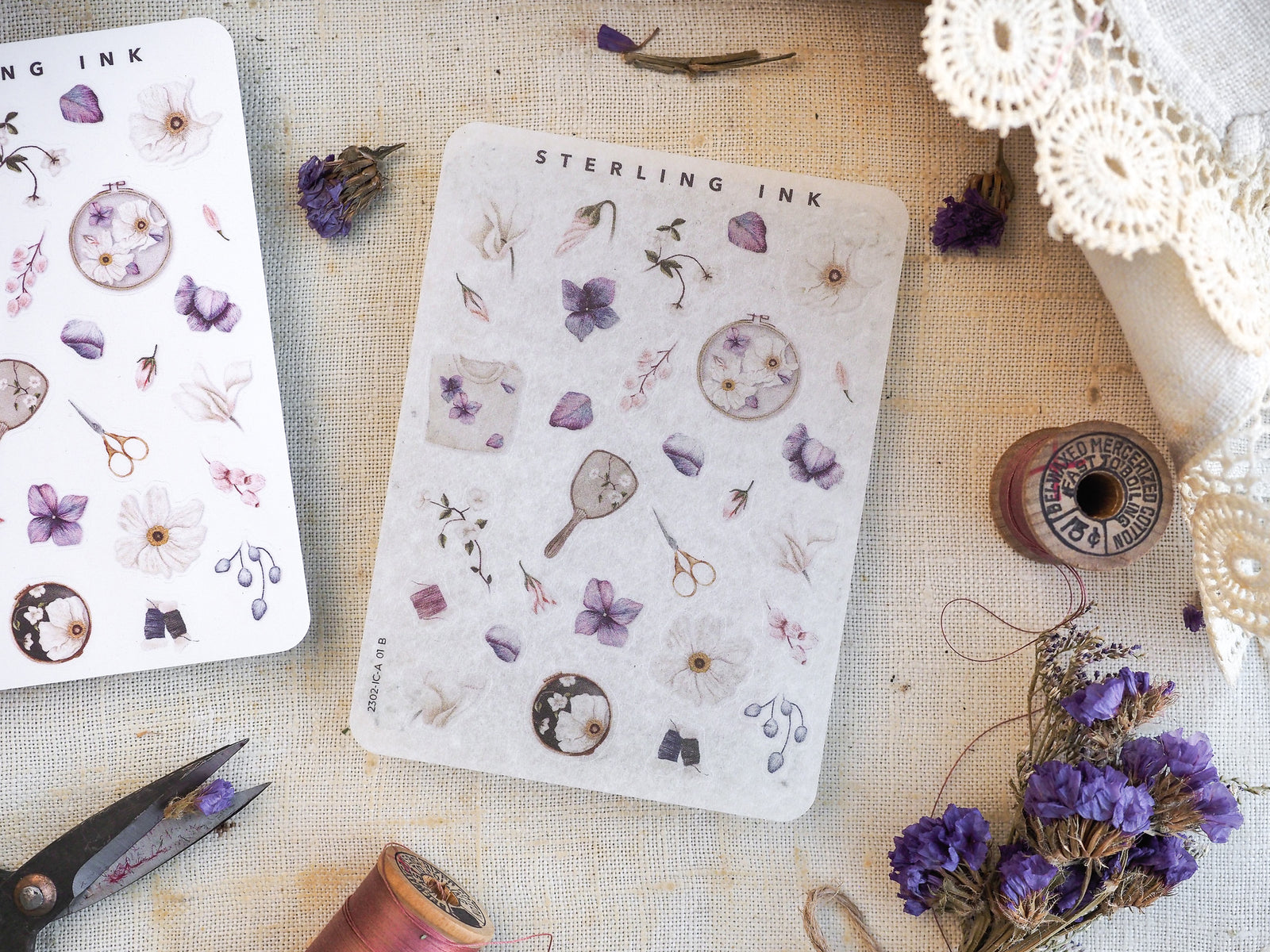 Vintage sticker sheets featuring botanical elements, tiny flowers, scientific tools, and ink-themed icons for creative journaling and planning.