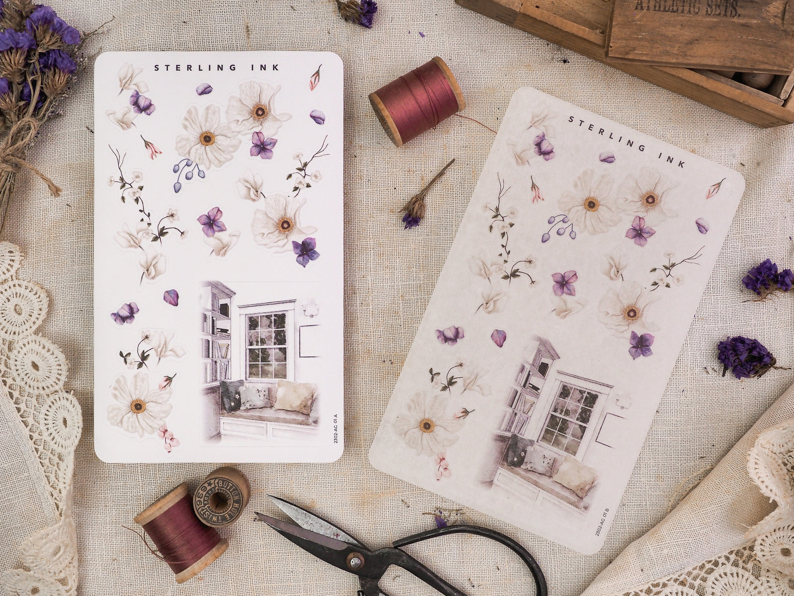 Watercolor sticker sheet featuring pale botanical arrangements of purple blooms and a delicate vintage house illustration from Sterling Ink.