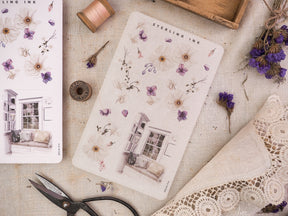 Whimsical sticker sheets featuring delicate watercolor flowers, trailing botanical sprigs, and sweet spring house vignettes.