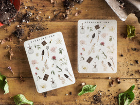 Botanical sticker sheets featuring an array of delicate scientific elements, including mortars, pestles, blooming flowers, and architectural icons, perfect for journaling and scrapbooking.