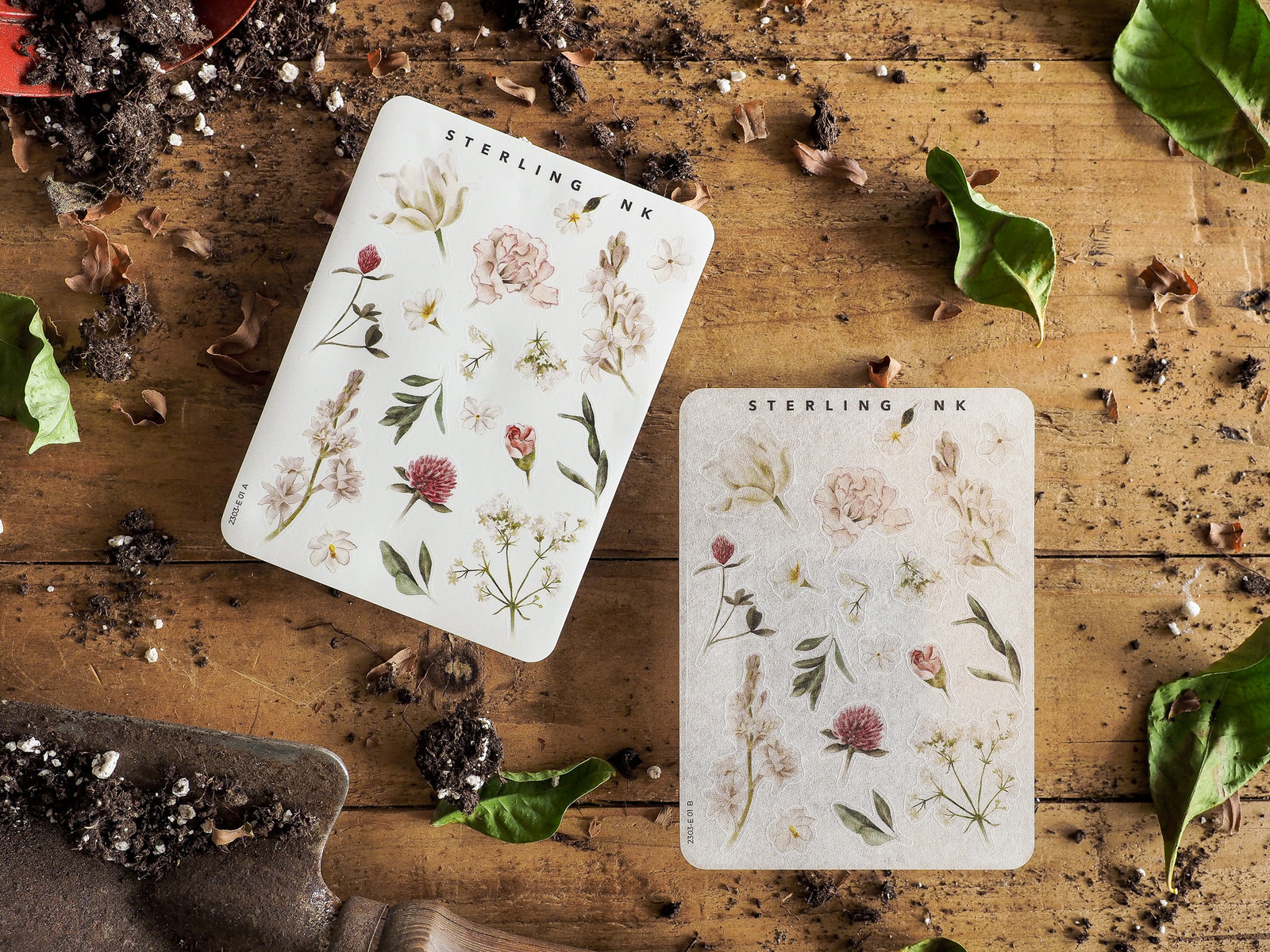 Botanical sticker set featuring pale, detailed illustrations of various delicate flowers, lush leaves, and autumnal natural elements.