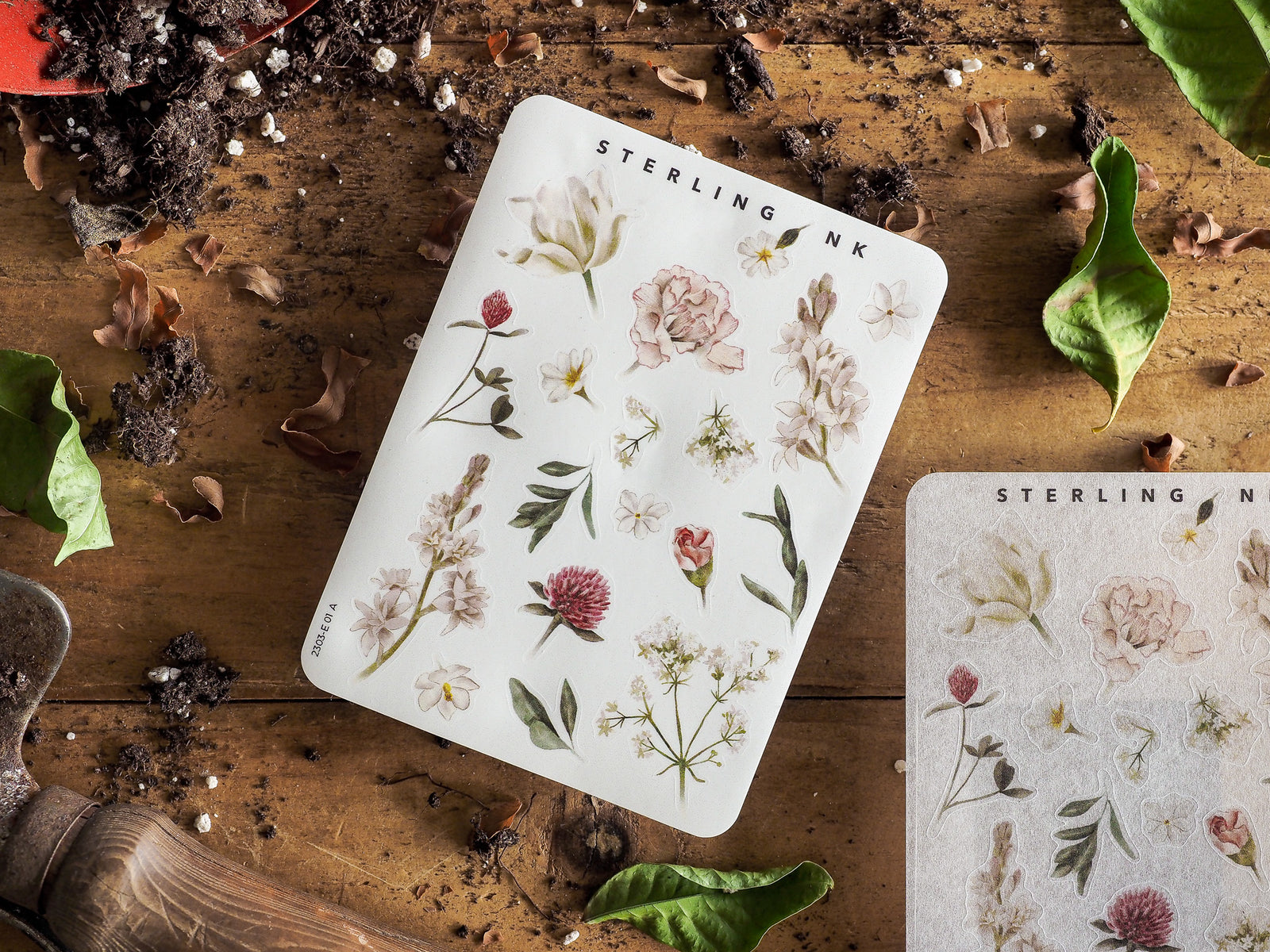 Botanical element sticker sheet featuring an array of watercolor illustrations, including delicate spring flowers, peonies, and varied green foliage.