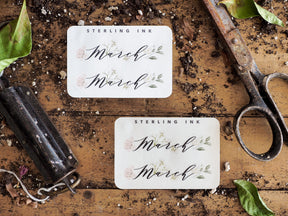 Seasonal "March" month stickers with a beautiful vintage floral design, featuring delicate green and blush watercolor botanical accents on elegant cream paper.