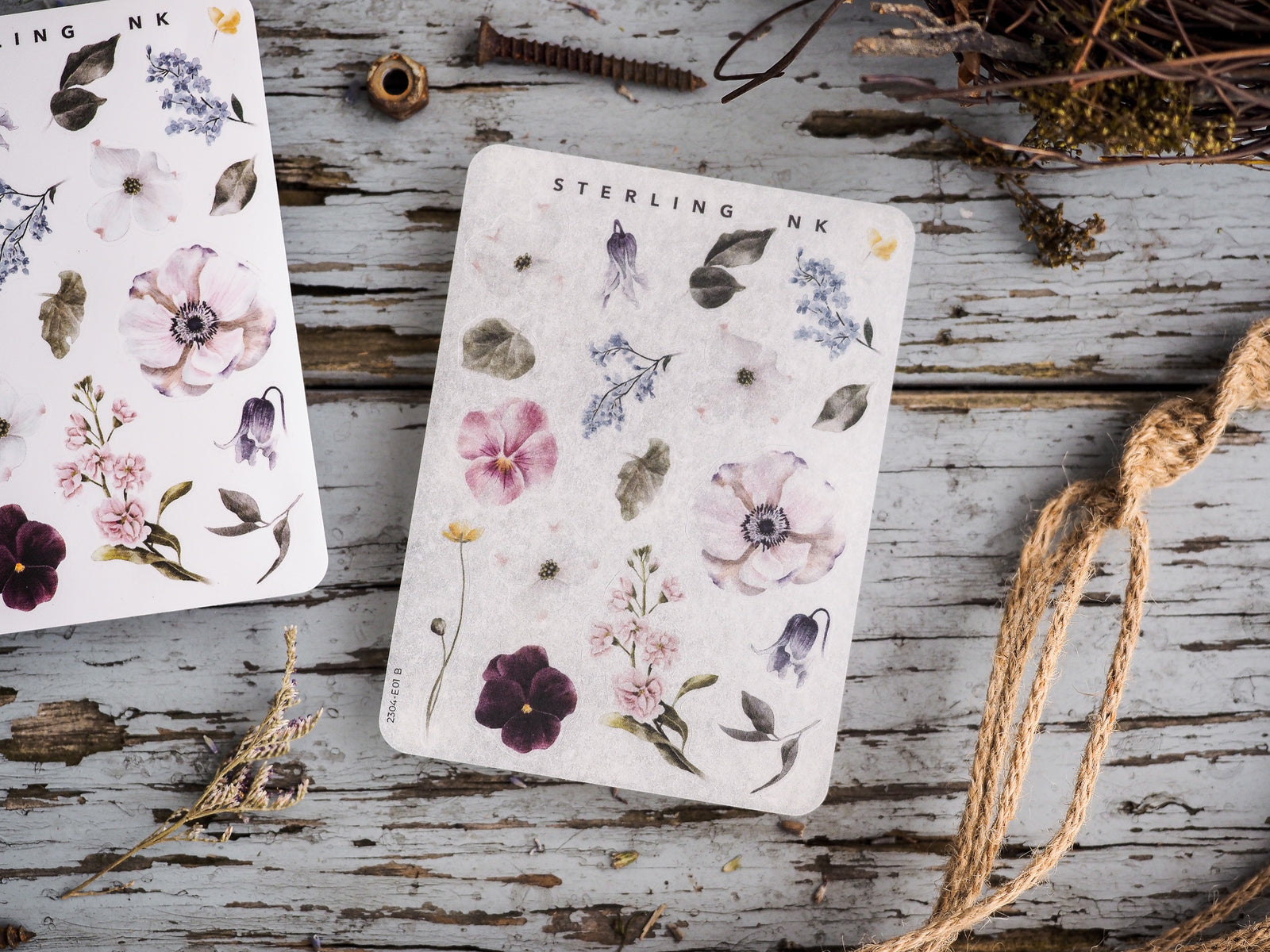 Watercolor sticker elements featuring a variety of botanical designs, including vibrant pink poppies, purple lavender, and delicate blue filler flowers.