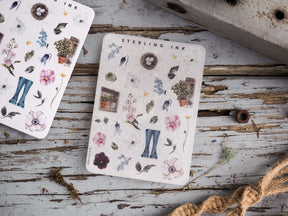 Decorative sticker icons featuring a spring botanical theme, including watercolor flowers, natural wreaths, and stylized blue jeans motif.
