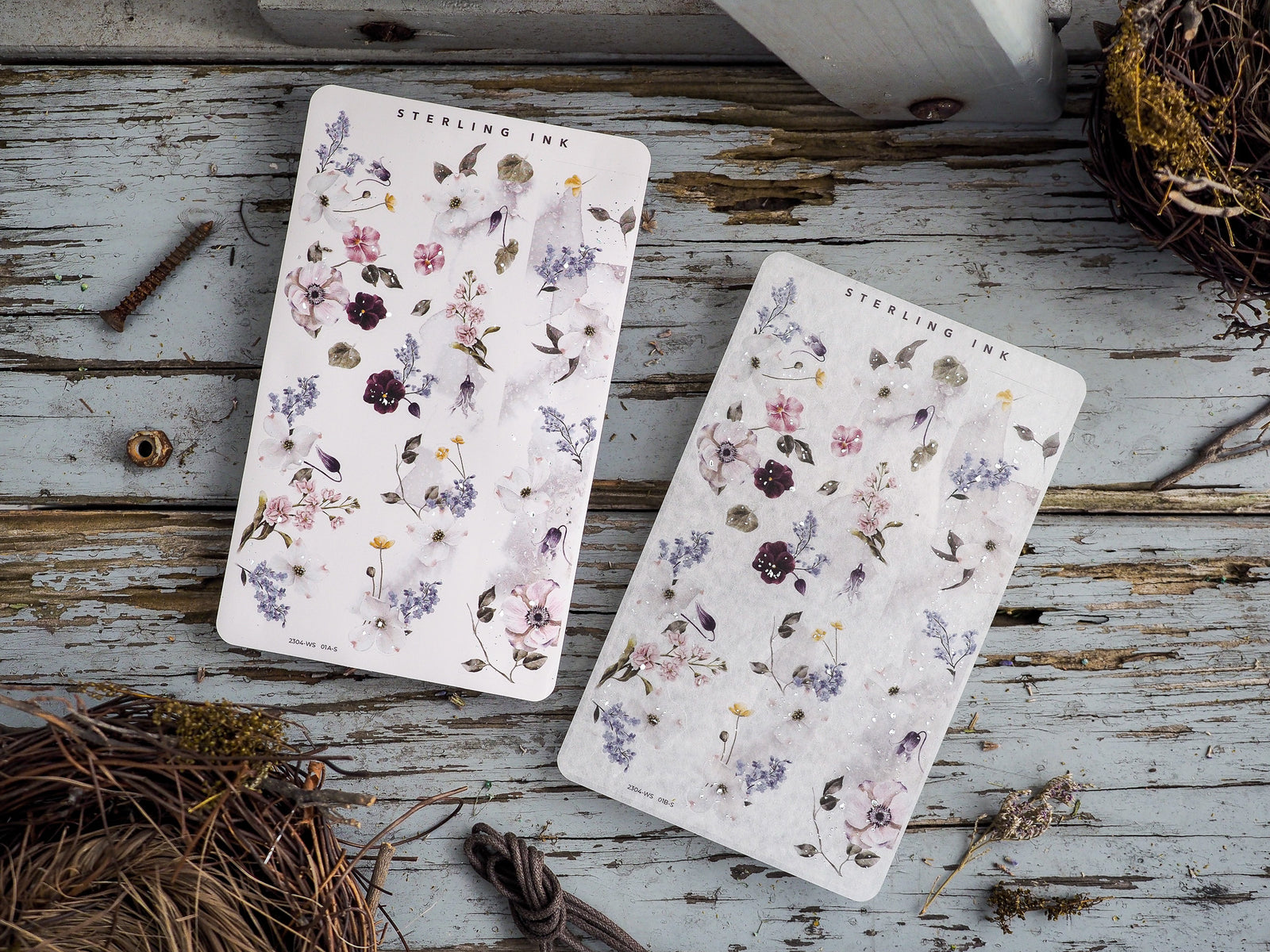 Charming washi sticker sheet featuring a soft watercolor botanical pattern of spring florals, including lilacs, lavender, and dusty pink wildflowers.