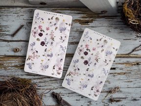 Charming washi sticker sheet featuring a soft watercolor botanical pattern of spring florals, including lilacs, lavender, and dusty pink wildflowers.