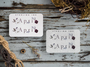 Delicate April month stickers featuring printed botanical designs and purple florals, perfect for organizing and journaling.