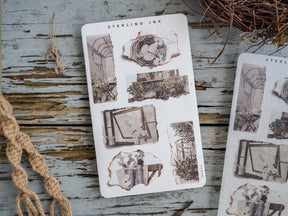 Torn paper sticker sheet featuring rustic architectural elements and botanical prints in a distressed, vintage sepia-toned style.
