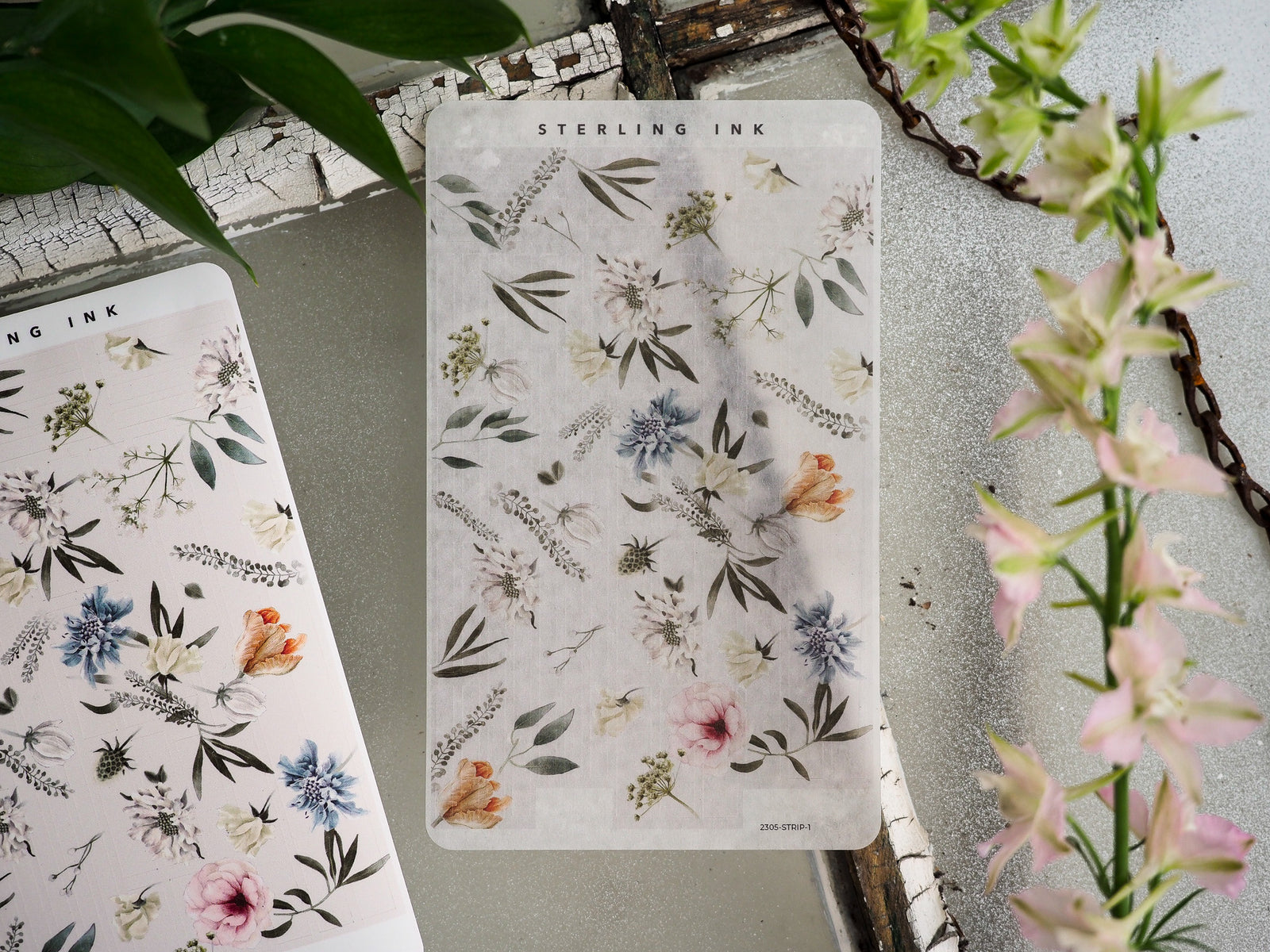 Watercolor botanical sticker strip adorned with soft pastel illustrations of mixed wildflowers, leaves, and greenery.