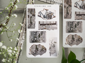 Collection of torn paper stickers featuring black-and-white sketches of quaint street shops, evoking a vintage European architectural and cozy town theme.