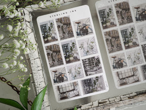 Vintage sepia sticker sheet featuring a grid of monochrome architectural designs, depicting aged city buildings, windows, and wrought iron details.